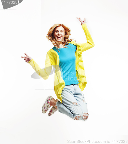 Image of young pretty teenage girl jumping cheerful isolated on white background, lifestyle people concept