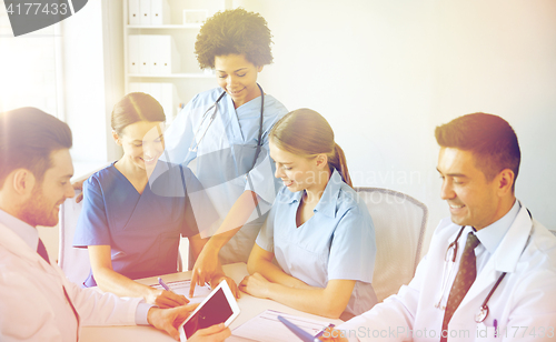 Image of group of happy doctors meeting at hospital office