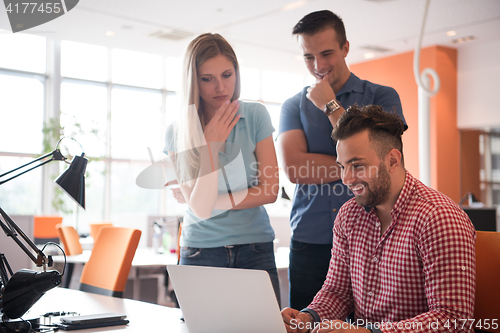 Image of Group of young people employee workers with computer