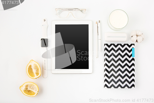 Image of Top view of whitepink pastel office table. Flat lay image.