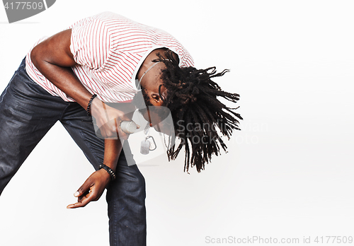 Image of young handsome african american boy singing emotional with micro