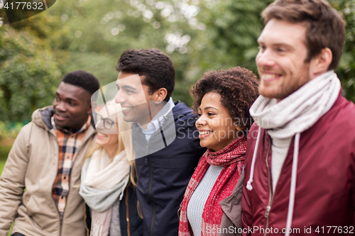 Image of group of happy international friends outdoors
