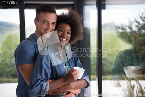 Image of romantic happy young couple relax at modern home indoors