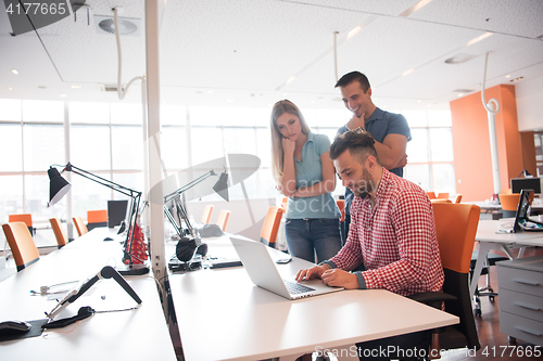 Image of Group of young people employee workers with computer