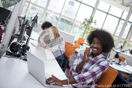 Image of African American informal business woman working in the office