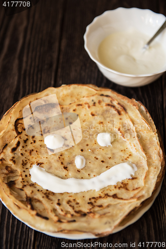 Image of Fried tasty smiling pancakes