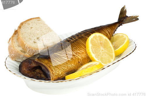 Image of Smoked mackerel with lemon slice isolated