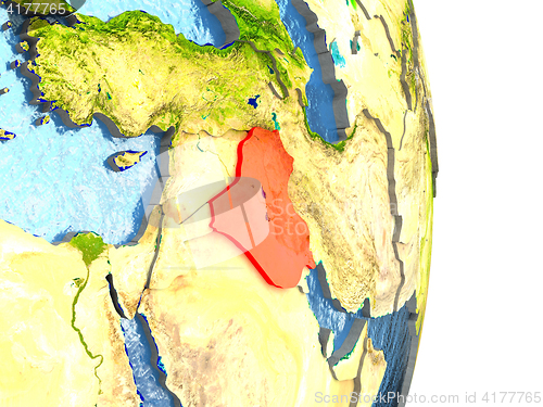 Image of Iraq in red on Earth