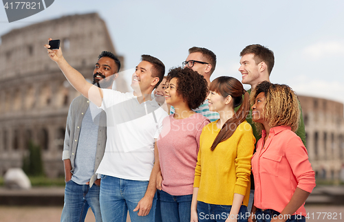 Image of group of people taking selfie by smartphone