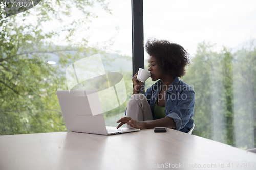 Image of African American woman in the living room