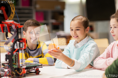 Image of happy children with 3d printer at robotics school