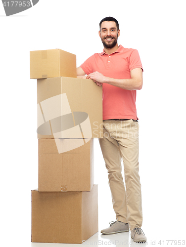 Image of happy man with cardboard boxes