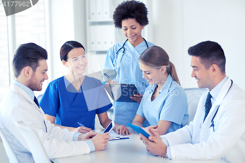 Image of group of happy doctors meeting at hospital office