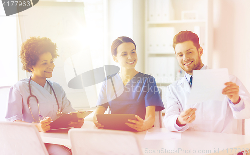 Image of group of happy doctors meeting at hospital office