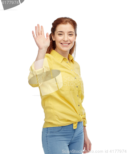 Image of happy smiling woman waving hand over white