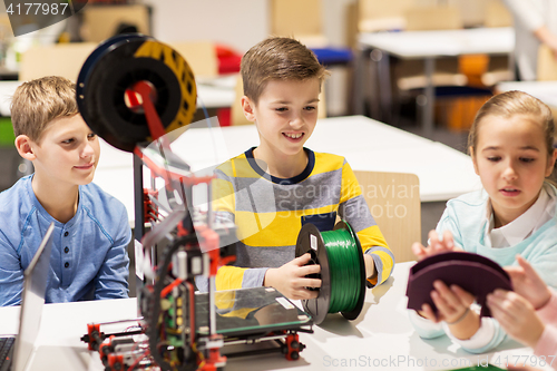 Image of happy children with 3d printer at robotics school