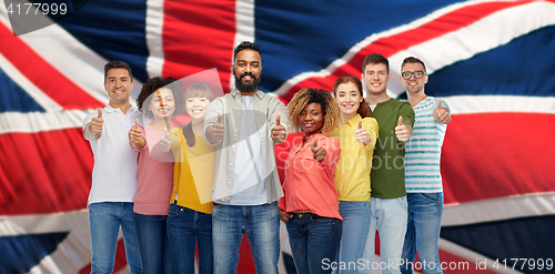 Image of international group of people showing thumbs up