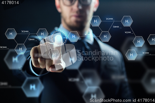 Image of close up of scientist and virtual chemical formula