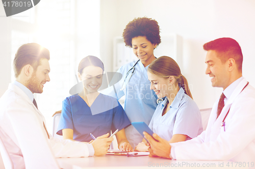Image of group of happy doctors meeting at hospital office