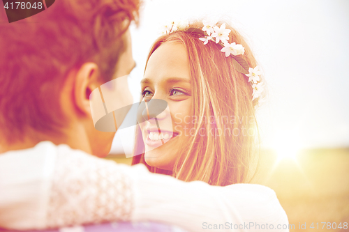 Image of happy smiling young hippie couple outdoors