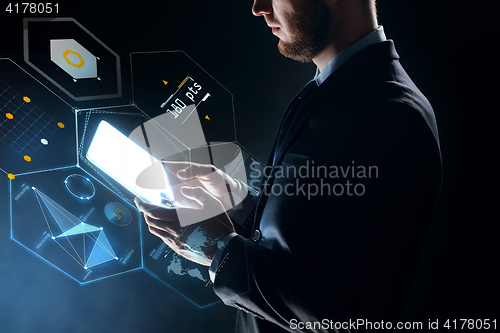 Image of businessman with tablet pc and virtual projection