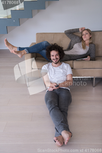 Image of young couple relaxes in the living room