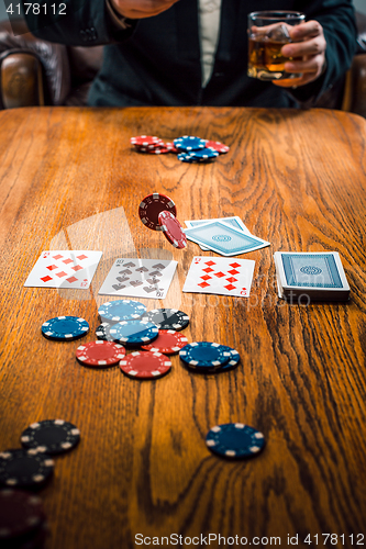 Image of The chips for gamblings, drink and playing cards