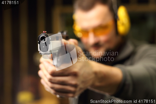 Image of Shooting a gun at shooting range