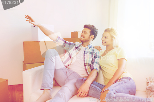 Image of couple with boxes moving to new home and dreaming