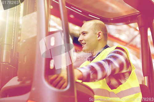 Image of man operating forklift loader at warehouse