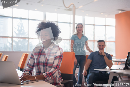 Image of African American informal business woman working in the office