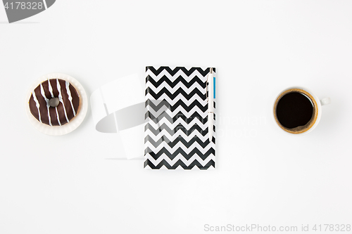 Image of Top view of white office female workspace with notebook