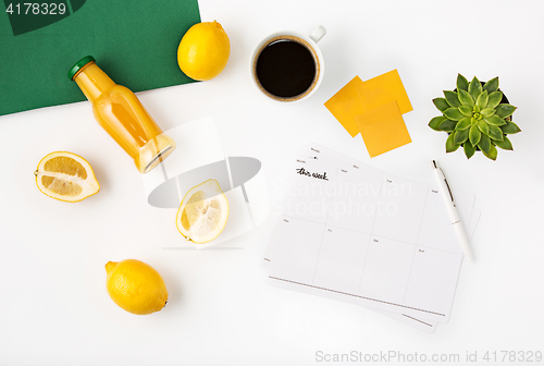 Image of Top view of white office female workspace with notebook