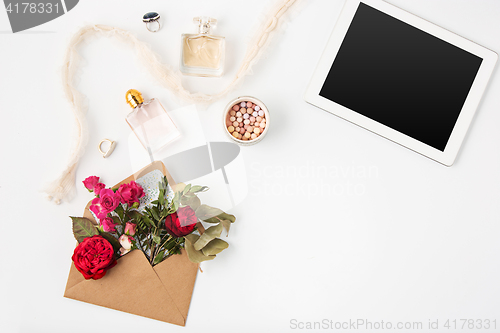 Image of Top view of white office female workspace with laptop