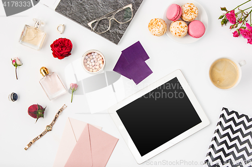 Image of Top view of white office female workspace with laptop