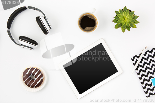 Image of Top view of white office female workspace with laptop