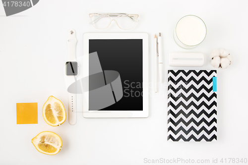 Image of Top view of white office table with laptop