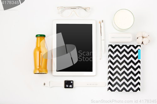 Image of Top view of white office table with laptop