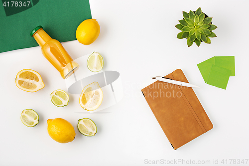 Image of Top view of white office female workspace with notebook