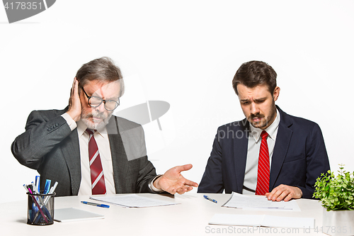 Image of The two colleagues working together at office on white background.