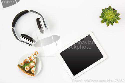 Image of Top view of white office female workspace with laptop