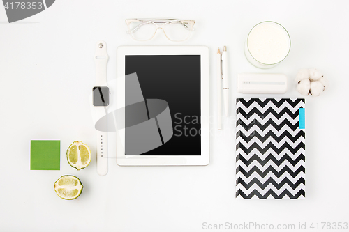 Image of Top view of white office table with laptop