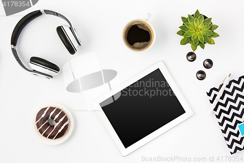 Image of Top view of white office female workspace with laptop