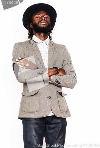 Image of young handsome afro american boy in stylish hipster hat gesturin