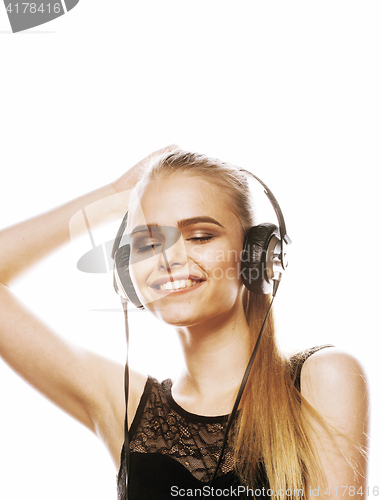 Image of young sweet talented teenage girl in headphones singing isolated