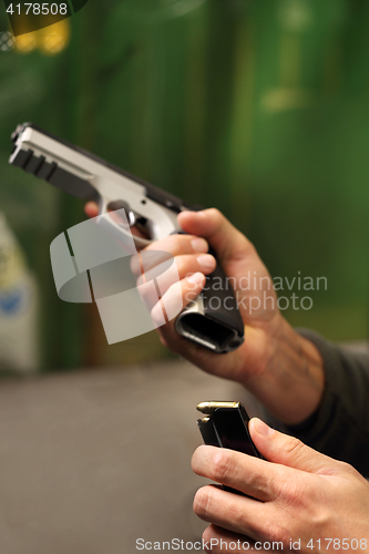 Image of Shooting a gun at a shooting range.