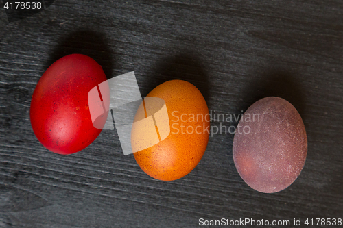 Image of Easter eggs on wooden background.