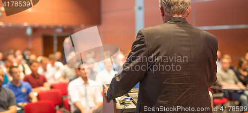 Image of Speaker at Business Conference and Presentation.