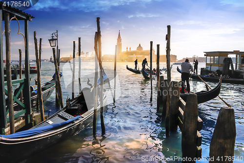 Image of Venetian Gondolas in Italy, sunset behind San Giorgio Maggiore c