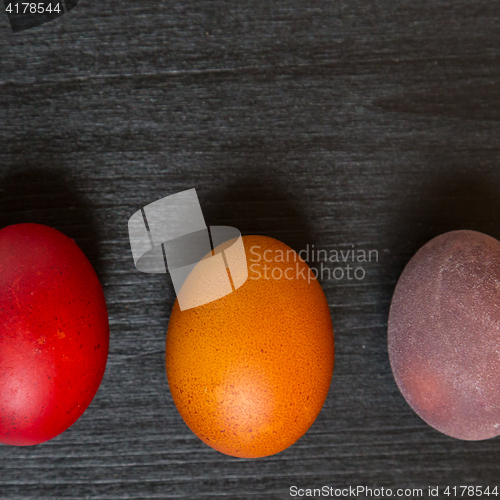 Image of Easter eggs on wooden background.